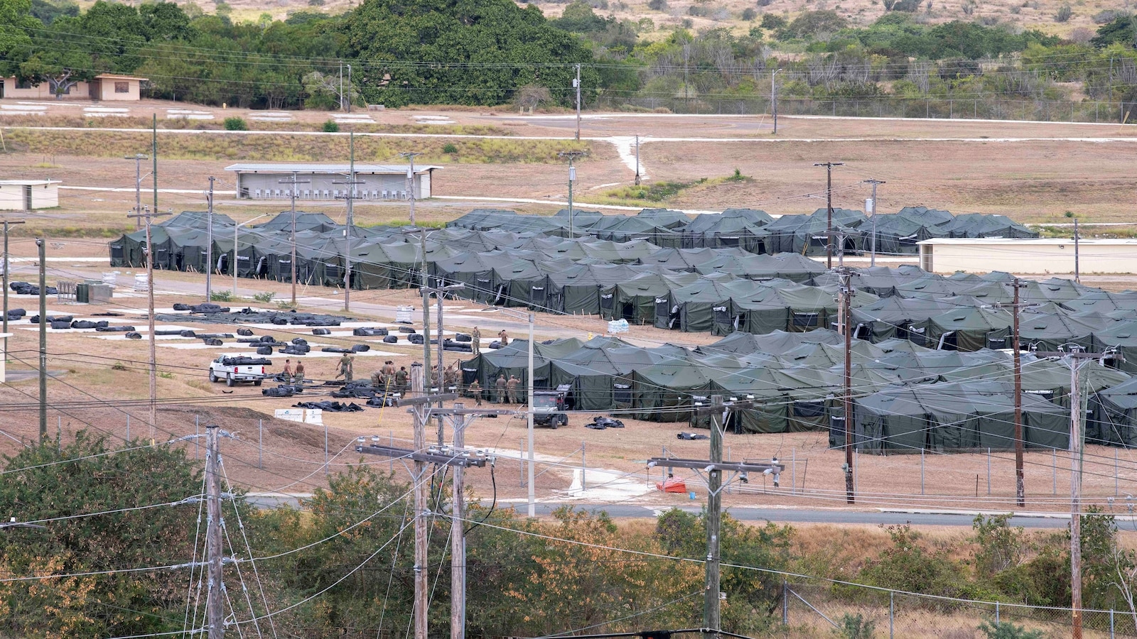 Migrants held at Guantanamo now allowed to phone attorneys, filing says - ABC News